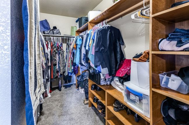 Spacious closet featuring carpet floors | Image 23