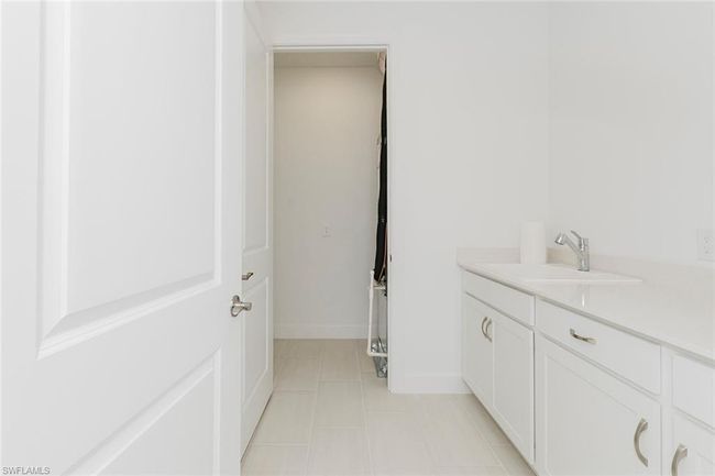 Bathroom with vanity and tile patterned flooring | Image 25