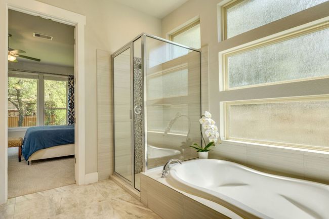 Primary bathroom with separate shower and soaking tub | Image 24