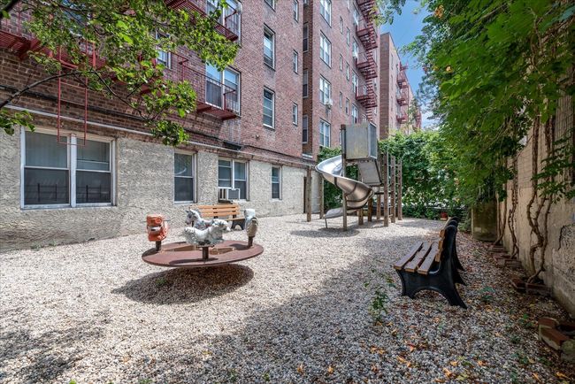 View of community featuring a playground | Image 12