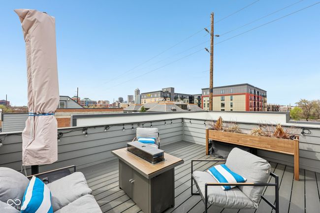 wooden deck with a view of city | Image 20