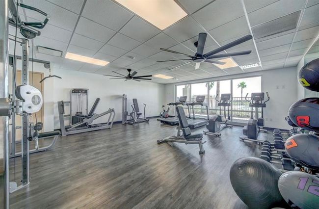 Achieve your fitness goals with this well-equipped home gym, designed to keep you in peak condition. | Image 30