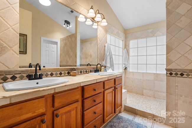 Primary bath has a large walk-in shower | Image 20