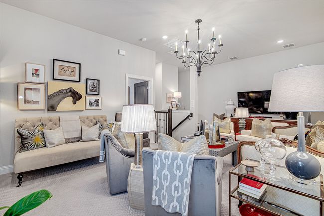 Living room featuring recessed lighting, carpet, visible vents, and an inviting chandelier | Image 25