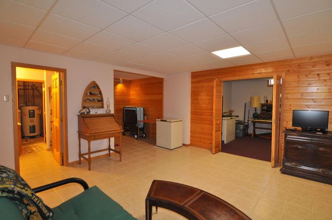 Lower level includes a 3/4 bath, sauna, bonus room and hobby room | Image 42