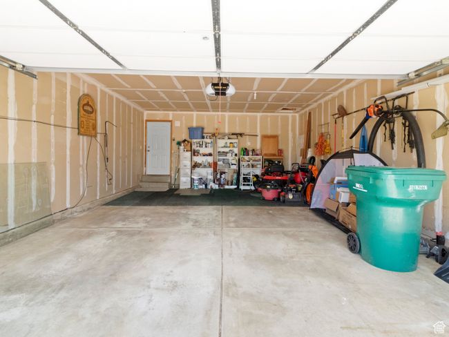 Garage with a garage door opener | Image 21