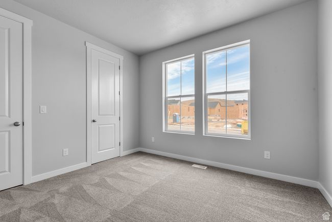 Unfurnished bedroom with carpet floors | Image 6
