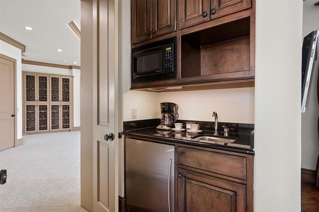 Imagine waking up to your own coffee bar and walking out onto the screened in porch off the Primary suite. | Image 32