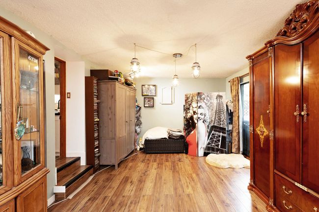 Foyer with light wood-type flooring, a textured ceiling, and stairway | Image 16