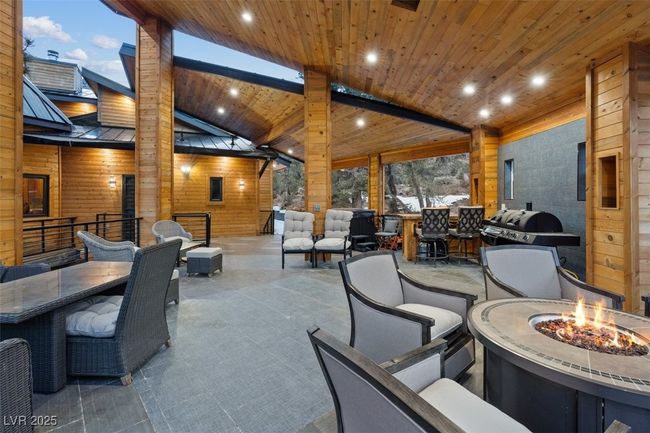 View of patio / terrace with an outdoor fire pit and a grill | Image 72