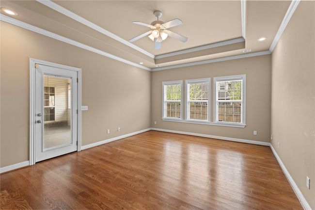 Master went with wood floors, patio access, and tons of natural light | Image 18