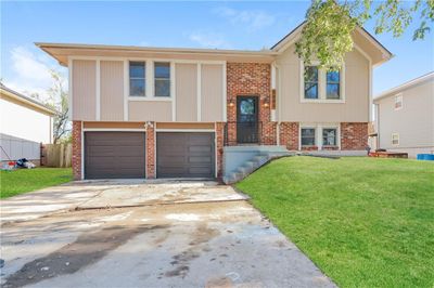 Split foyer home with a garage and a front yard | Image 1