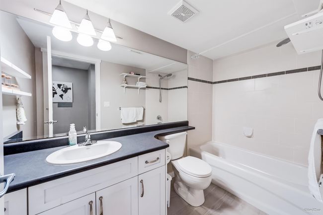 Bathroom featuring visible vents, vanity, toilet, and shower / bathtub combination | Image 25