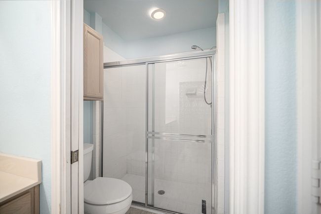 Step-in shower, linen cabinet and toilet. Can be closed off with pocket door. | Image 13