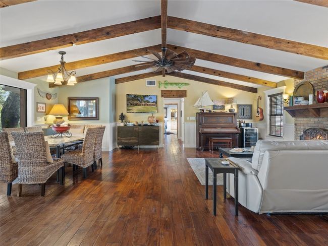 Great room features beams that were salvaged from the UT Alumni center during renovation. | Image 24