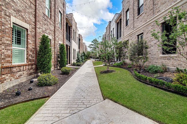 View of home's community featuring a yard | Image 5