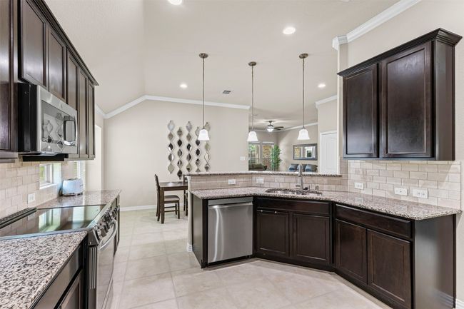 Open kitchen with eat in breakfast area | Image 4