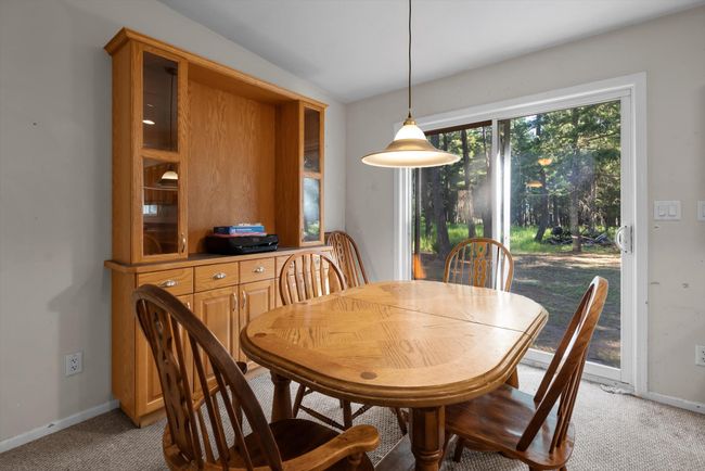 Dining area with built hutch. | Image 12