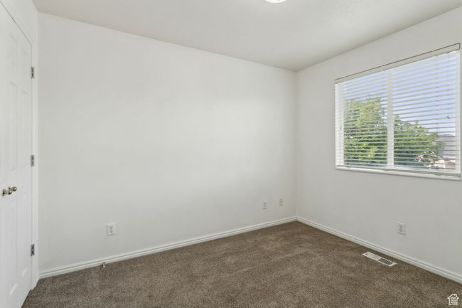 Spare room with carpet floors and baseboards | Image 16