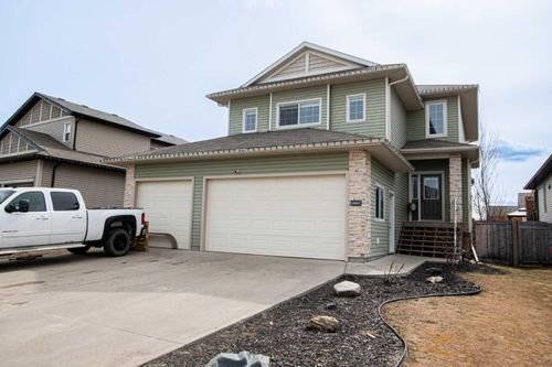 10217 125 Avenue, Home with 4 bedrooms, 3 bathrooms and 6 parking in Grande Prairie AB | Card Image