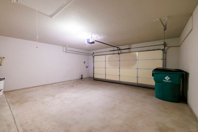 Garage featuring a garage door opener | Image 28