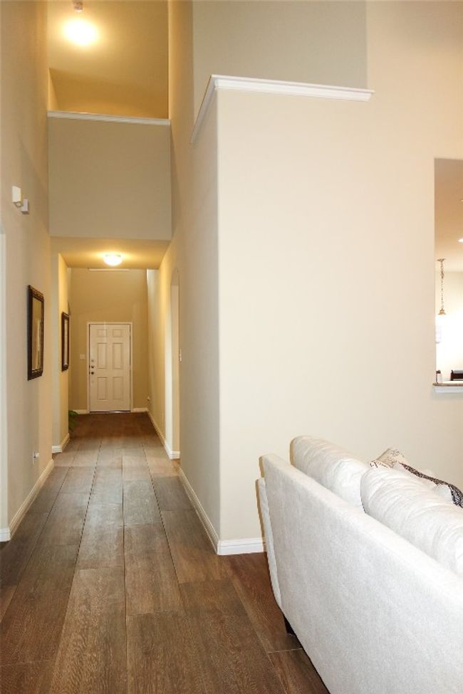 Hallway with front door in view. | Image 14