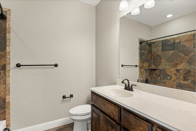 Full bath featuring vanity and a shower | Image 9
