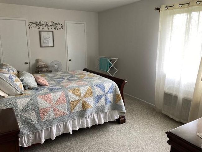 View of carpeted bedroom | Image 11