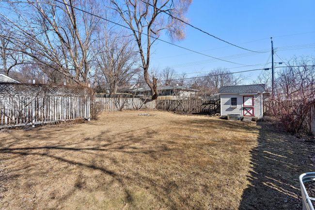 The backyard has room for gardening and for playing yard games in the summer. | Image 29