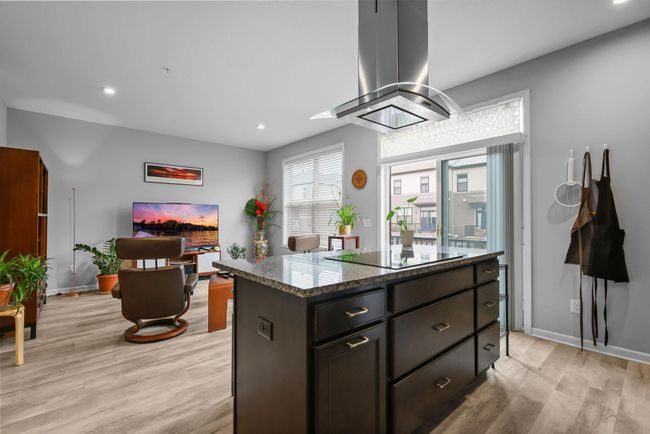 Open concept - kitchen opens into the family room. | Image 15