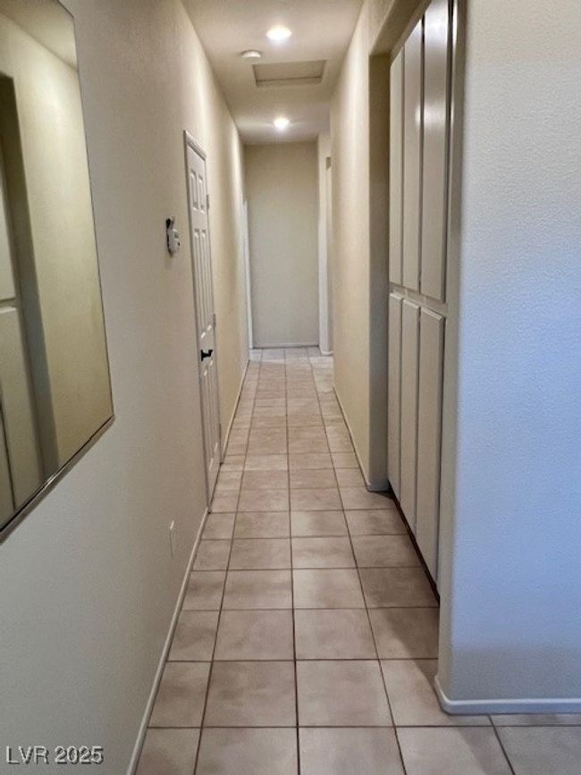 Unfurnished bedroom with light tile patterned floors, baseboards, a ceiling fan, and a closet | Image 22