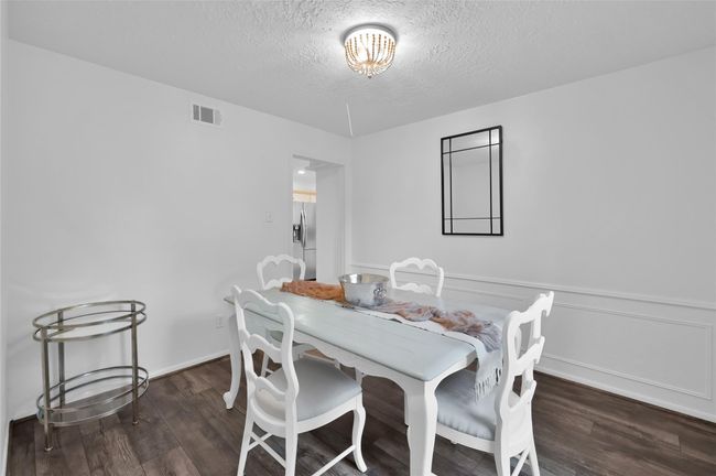 To the right of the Foyer is the Formal Dining Room and connects to the Kitchen. This room could easily be used for other activities like a play room or additional office. | Image 5