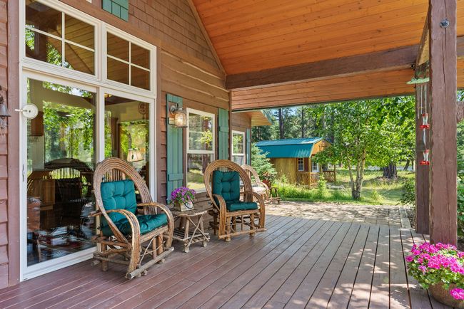 Expansive, Covered Front Porch with Serene River Views | Image 22