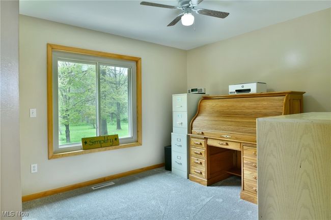 Office featuring a ceiling fan, carpet flooring, and baseboards | Image 21