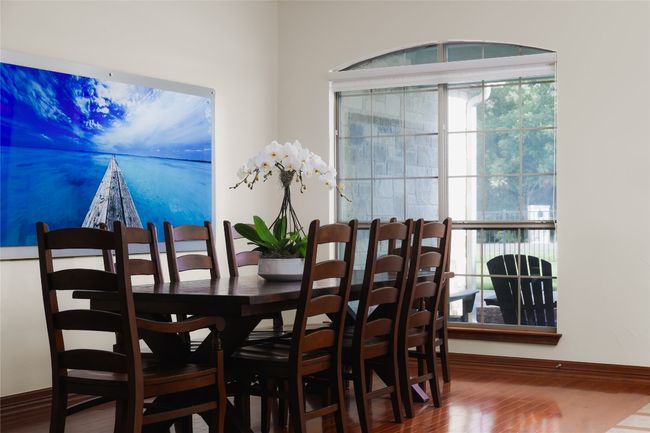 Dining room featuring wood finished floors and baseboards | Image 14