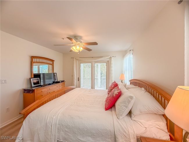 Bedroom featuring access to exterior, baseboards, and a ceiling fan | Image 31