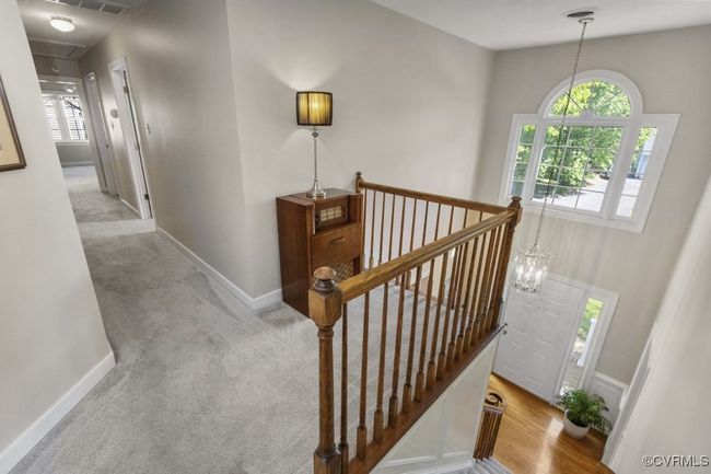 Stairs featuring attic access, plenty of natural light, baseboards, and carpet flooring | Image 29