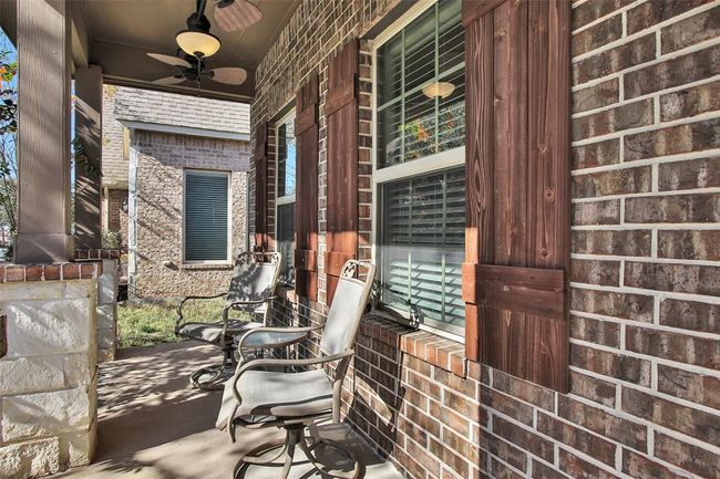 ...another view across the covered front porch. | Image 8