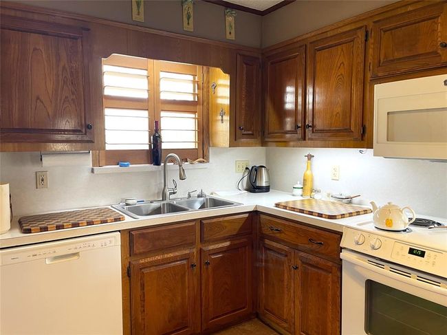 Window over sink looks out to the backyard | Image 9