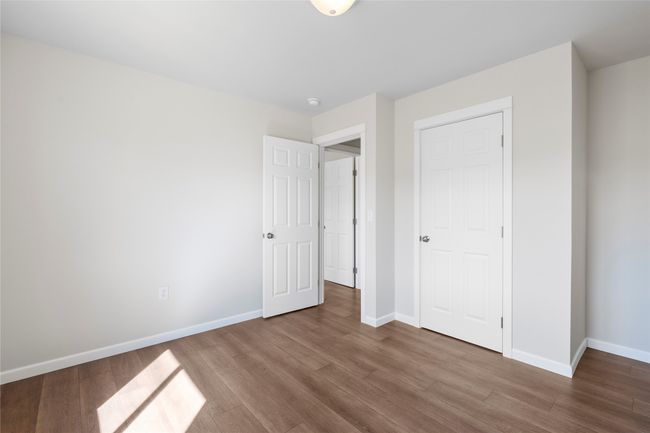 Unfurnished bedroom featuring baseboards and wood finished floors | Image 56