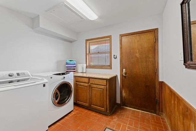 Roomy laundry room with storage | Image 20