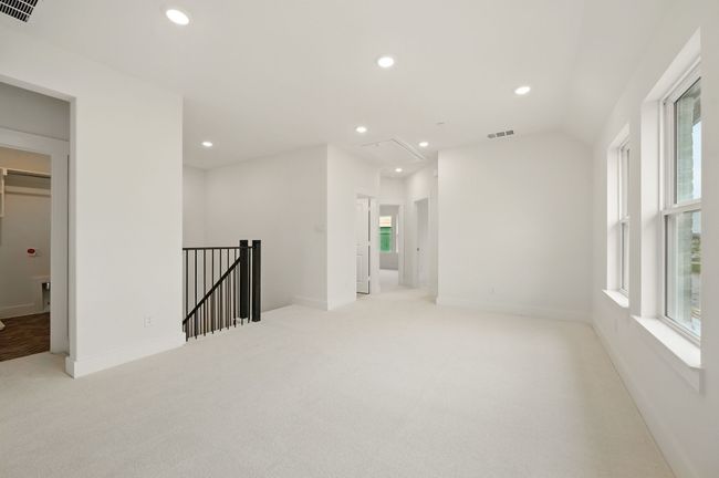 Upstairs you'll find a spacious game room that is the perfect place for additional family fun time. | Image 12