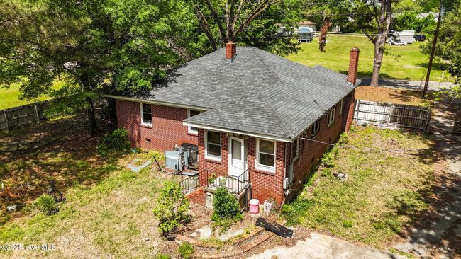 Rear of house with circular steps and patio | Image 39
