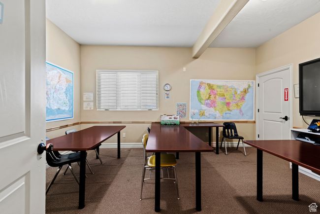 Home office featuring carpet, baseboards, and beam ceiling | Image 31