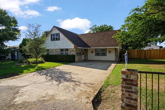 View of front of home featuring driveway and brick siding | Image 29