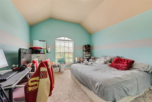 Carpeted bedroom with vaulted ceiling | Image 26