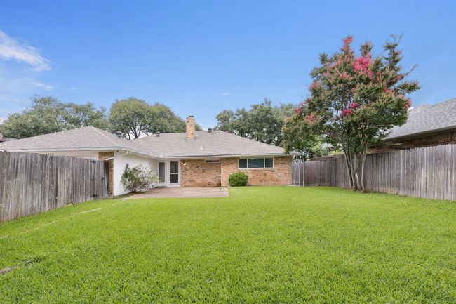 Large grassed backyard with dog run | Image 25
