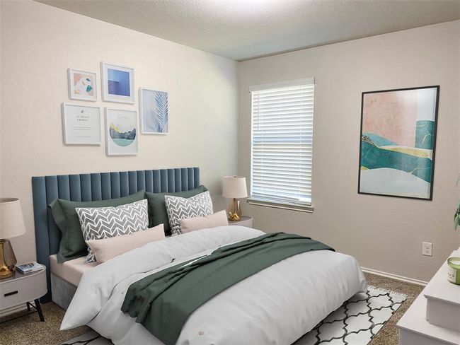 This cozy secondary bedroom features a split floorplan design. Virtual staging provides a visual of how you can make this room work for you. | Image 9