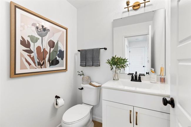 Bathroom featuring vanity and toilet | Image 6
