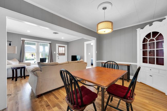 Dining space featuring crown molding and light wood-style flooring | Image 16
